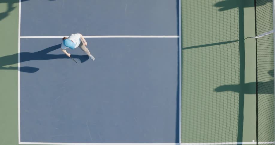 Two couples on a tennis court playing