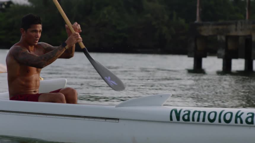 Two athletes canoeing on the river