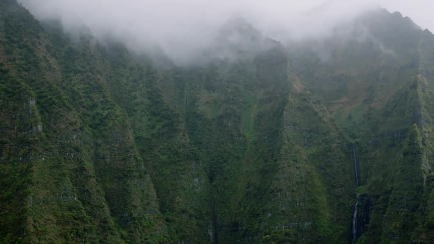 Mountain range landscape with low clouds