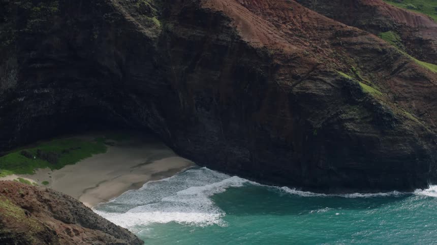 Aerial of a hidden beach between the cliffs on an island
