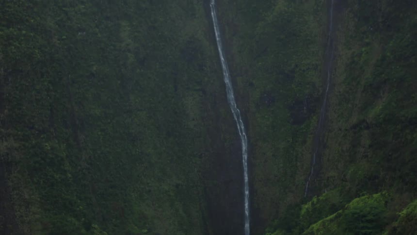 Landscape of a high mountain with a large waterfall