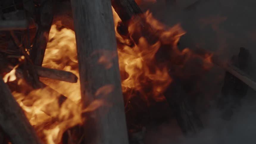 Close up of a burning bonfire giving off smoke