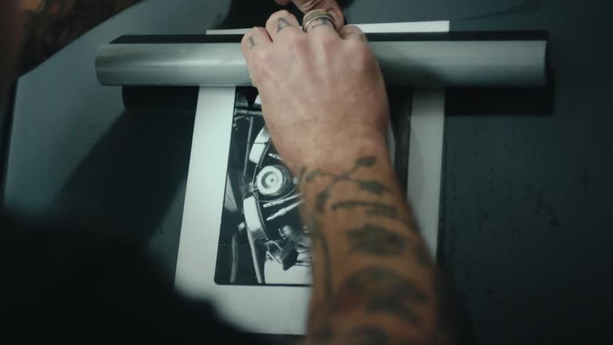 A clip of a person plastering a picture