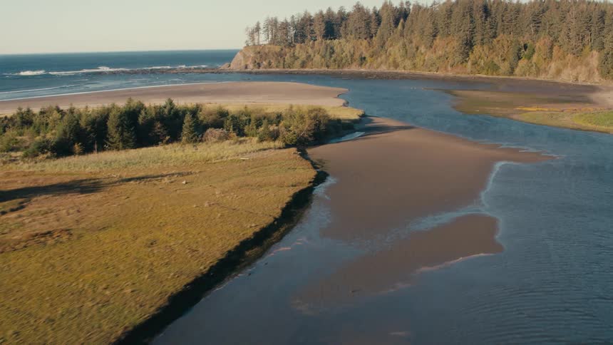 Aerial view of a river leading to the sea