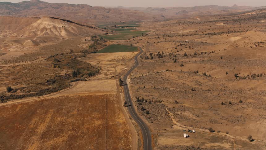 Aerial of a desert highway on a sunny day