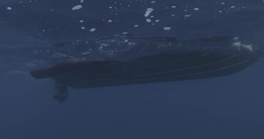 Bottom of a boat seen from underwater