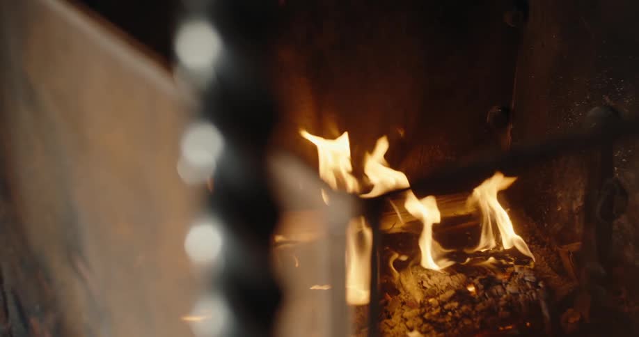 The fire is burning in the fire place