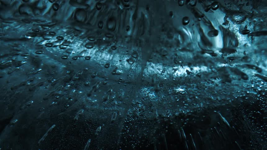 A transparent glasstextured object with some bubbles trapped inside