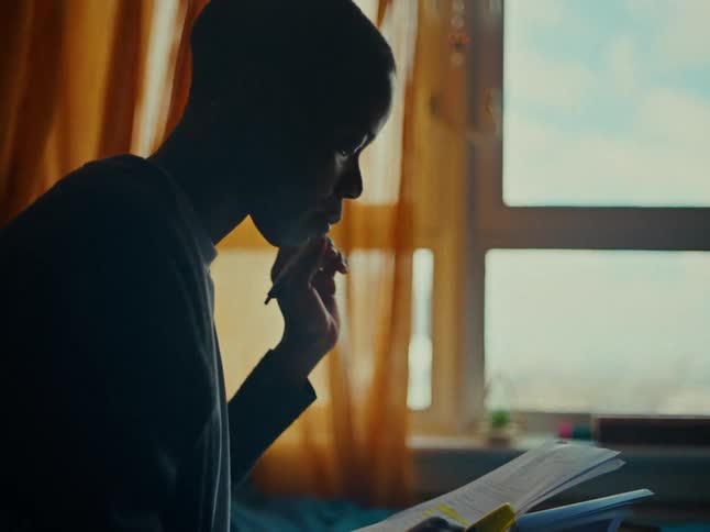 A clip of a woman studying indoors