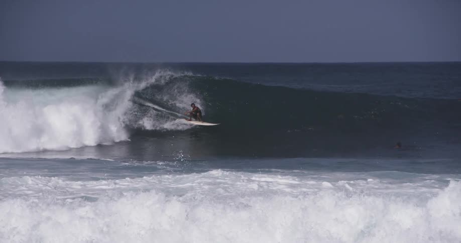 A surfer riding a large wave