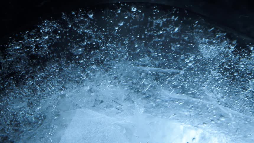Ice orbiting in water