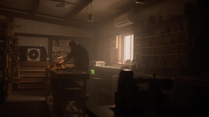 A clip of a man walking into a room