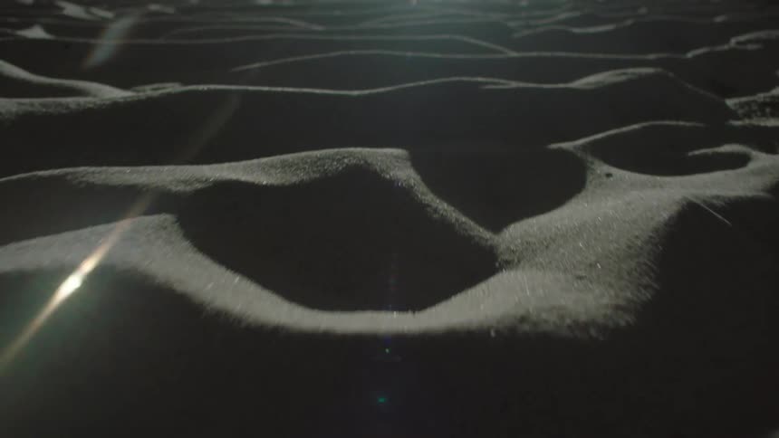 Light is reflecting on the sand