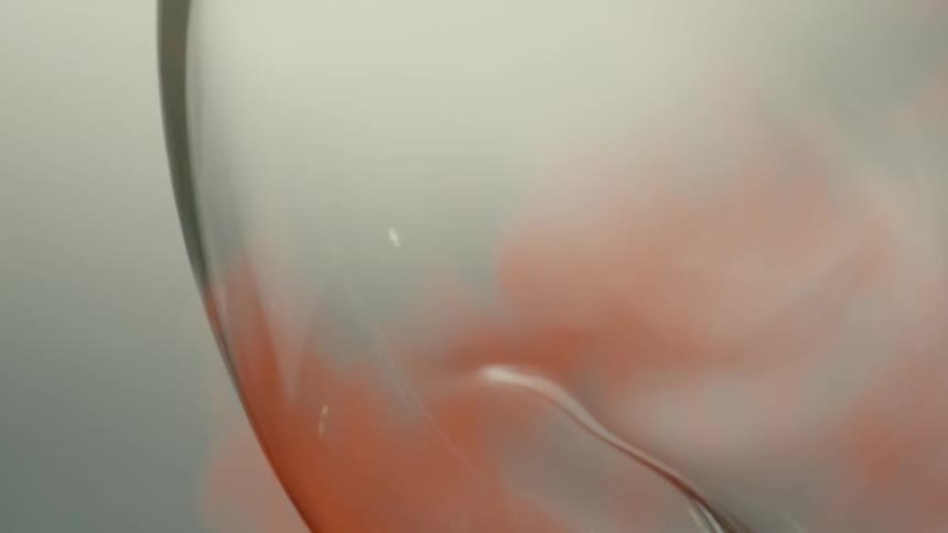 A glass vase is being heated by an open red flame