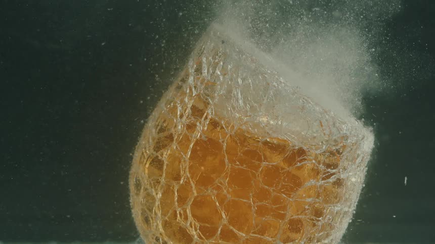 Abstract heated glass inside water with bubbles emerging