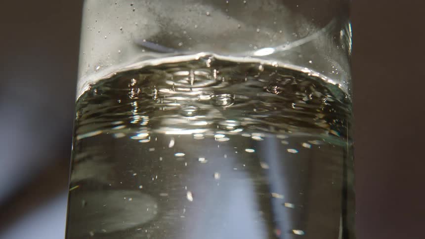 Close up of a glass of water with bubbles