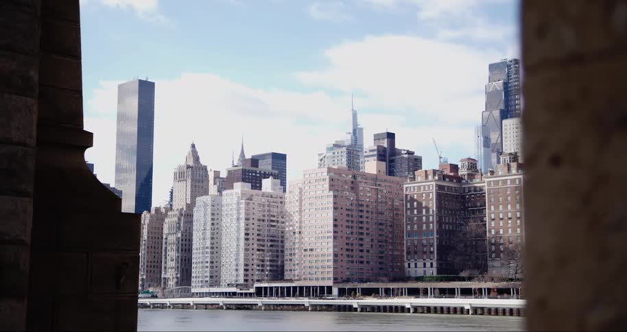 A large skyline is by the river