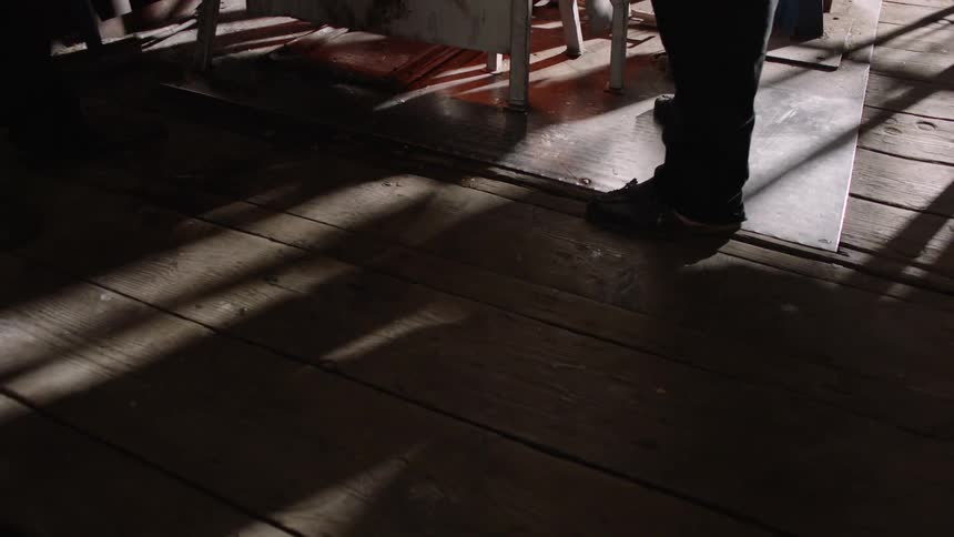 A person is working by a machine