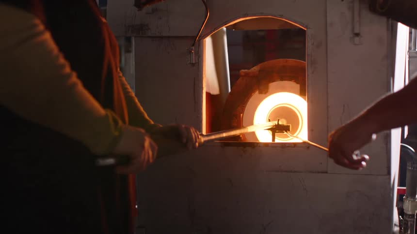 A clip of blacksmith working with the furnace