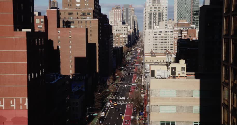 Aerial view of a metropolis and intersections with vehicle traffic