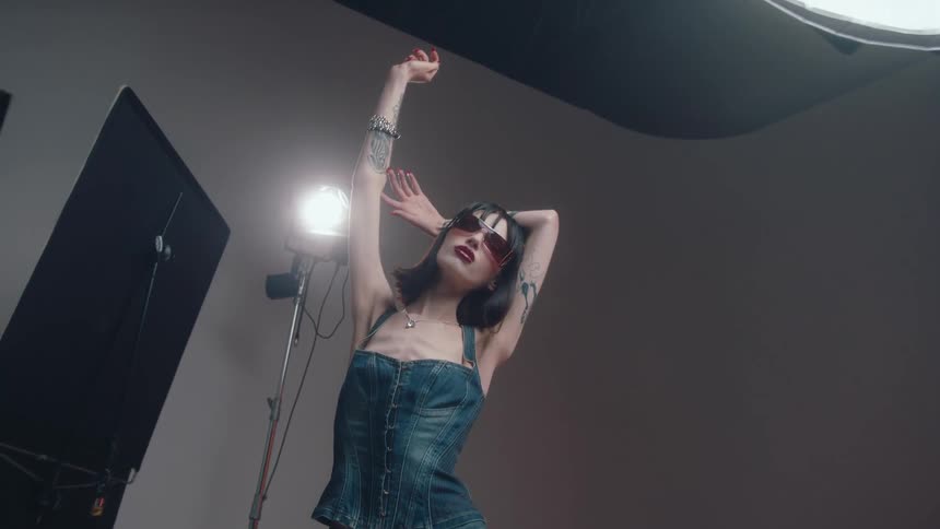 A model has her armed raised up in a pose