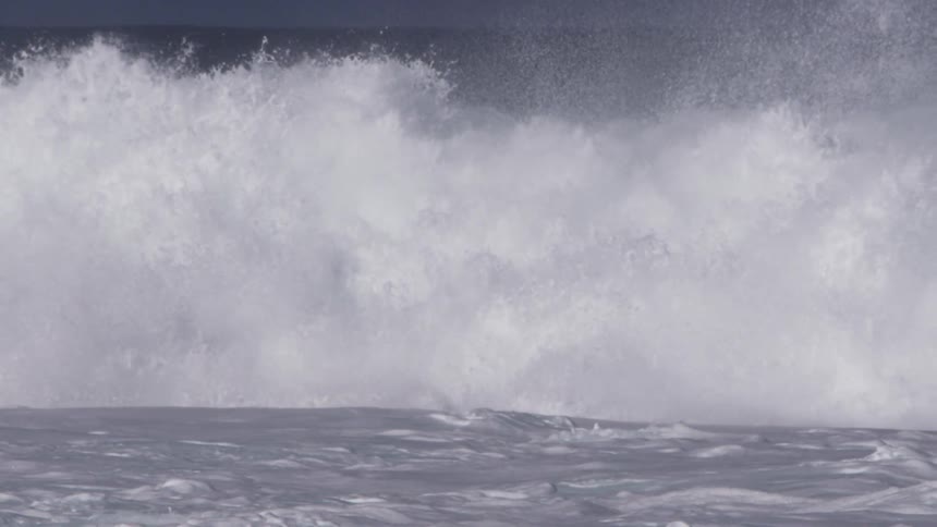 Large wave crashes on itself