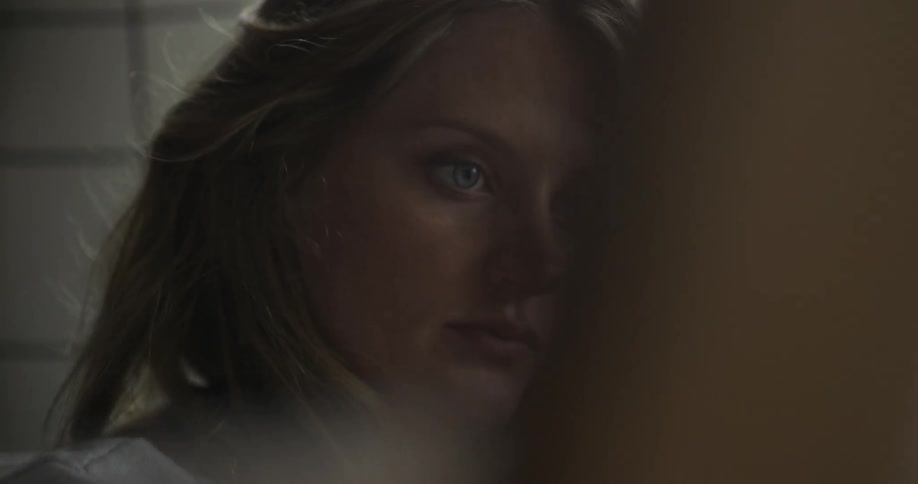 Woman blinks as she works on something