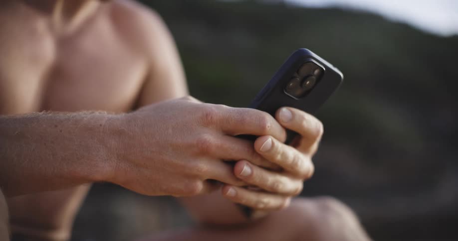 Pair of hands interacting with iphone