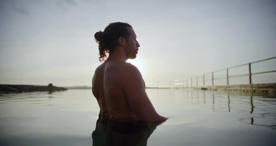Man inside a dam taking a deep breath