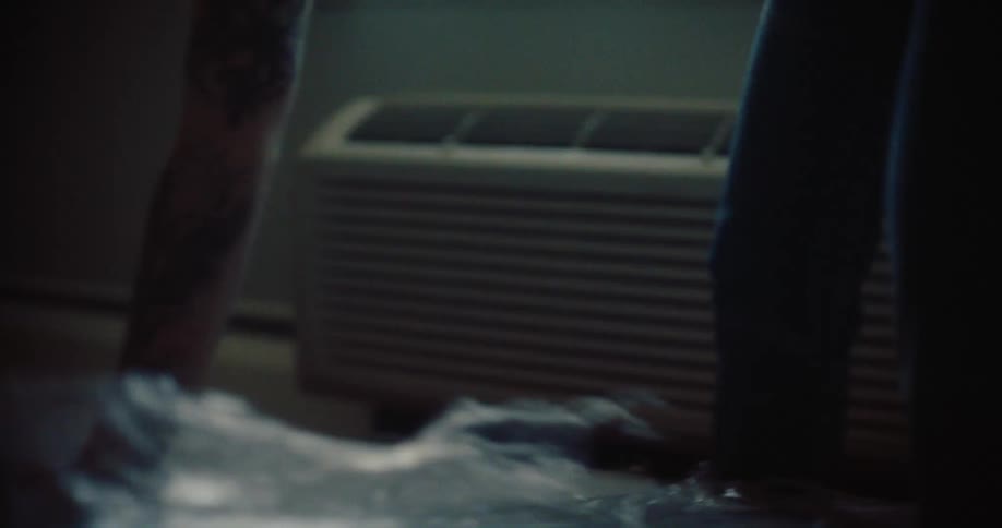 Person removing plastic from a mattress