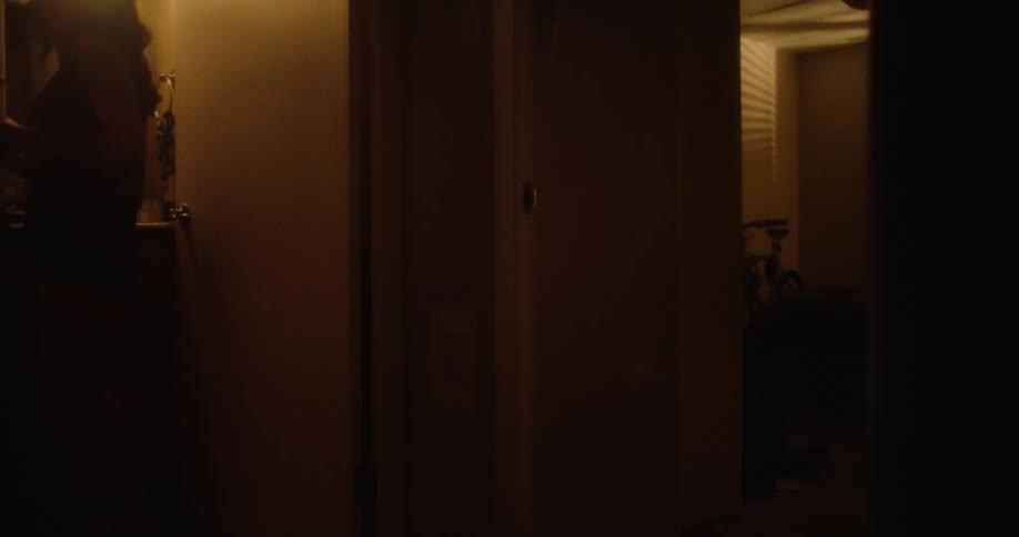 Woman using the bathroom turning off the light and leaving the room