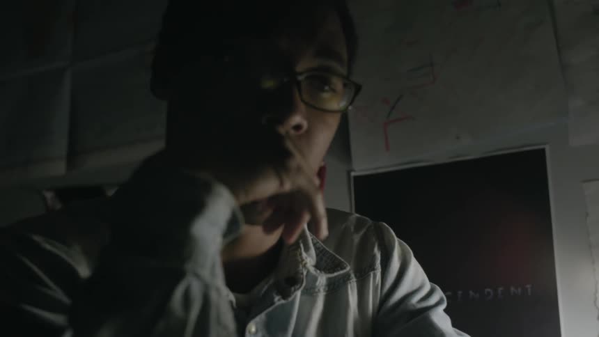 Man sitting at a desk thinking