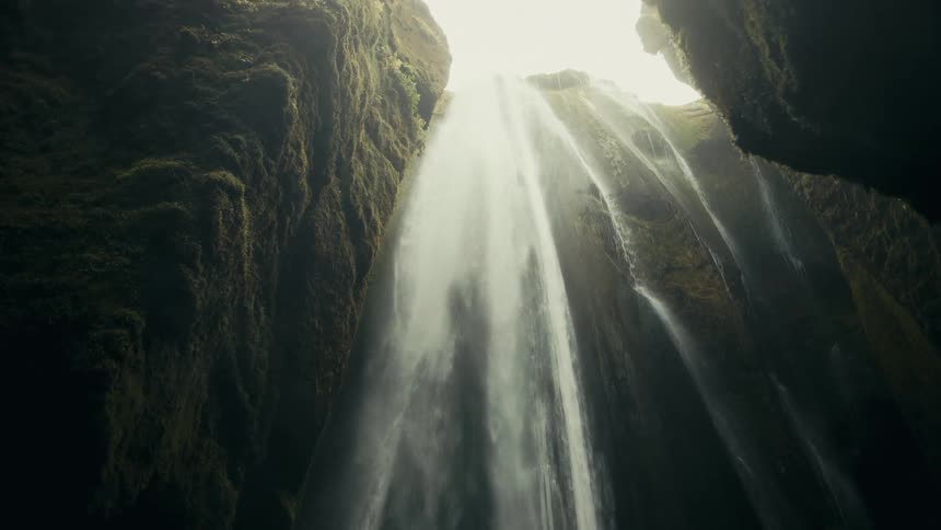 Water cascades down a waterfall