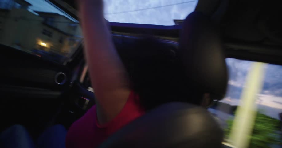Two women inside a car having fun