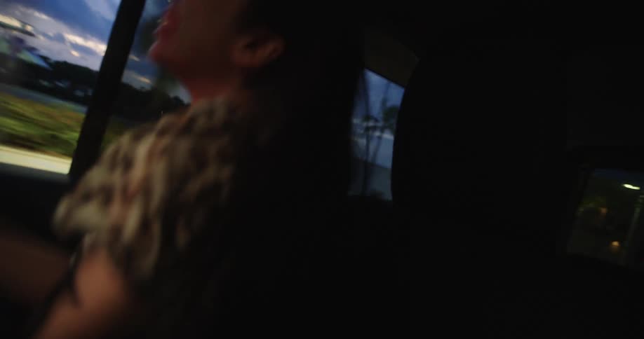 A group of girls dancing in a car having fun and enjoying the moment