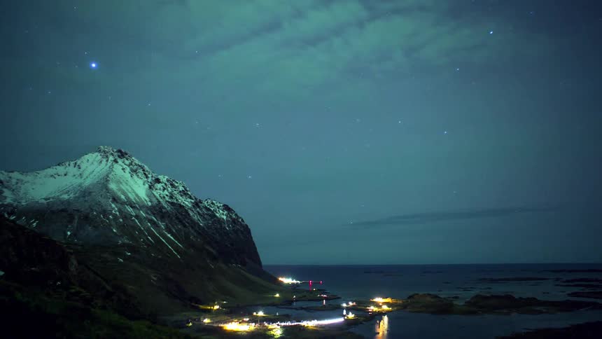 The northern lights shine in the night sky