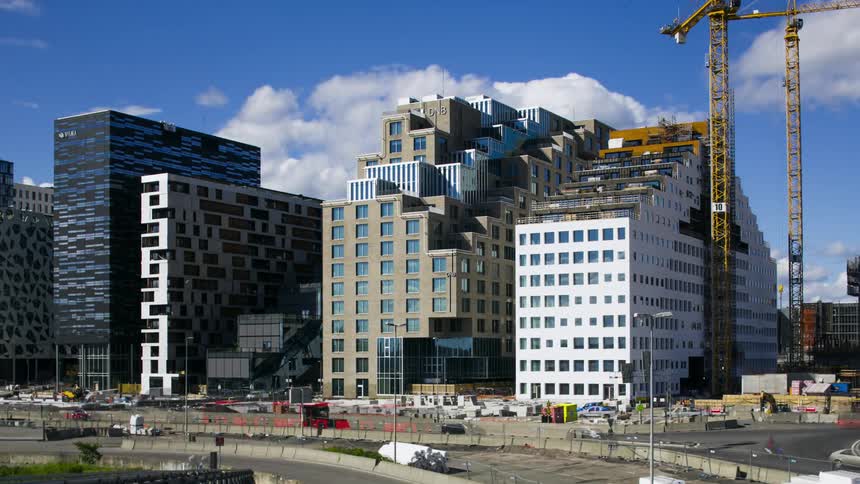 Heavy traffic next to modern buildings in a metropolis
