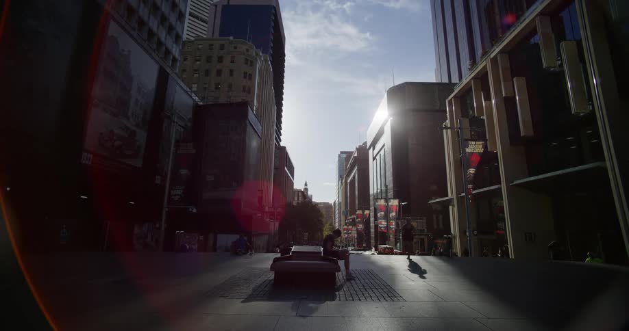 Pedestrians in an openair area surrounded by buildings in a metropolis