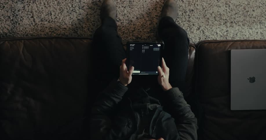 Pair of hands interacting with a tablet