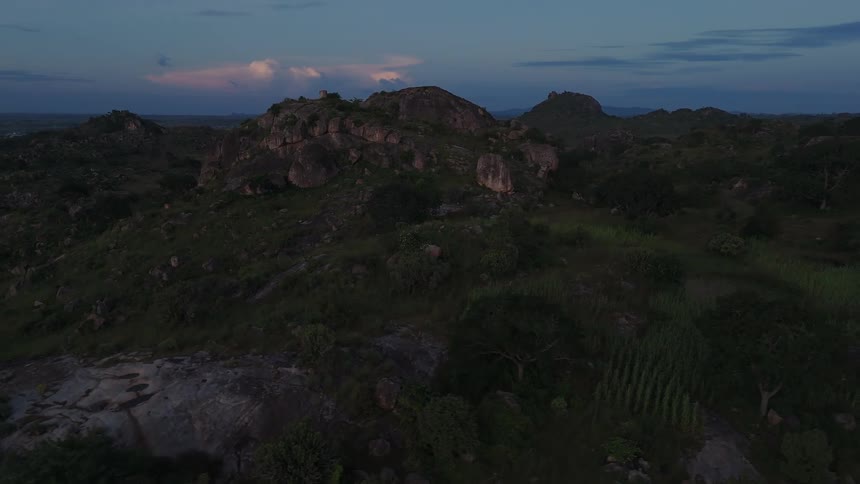 The sun is rising on the mountains