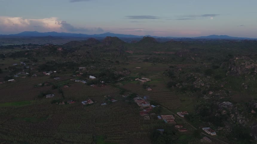 Aerial panorama of a natural area surrounded by mountains in a rural community