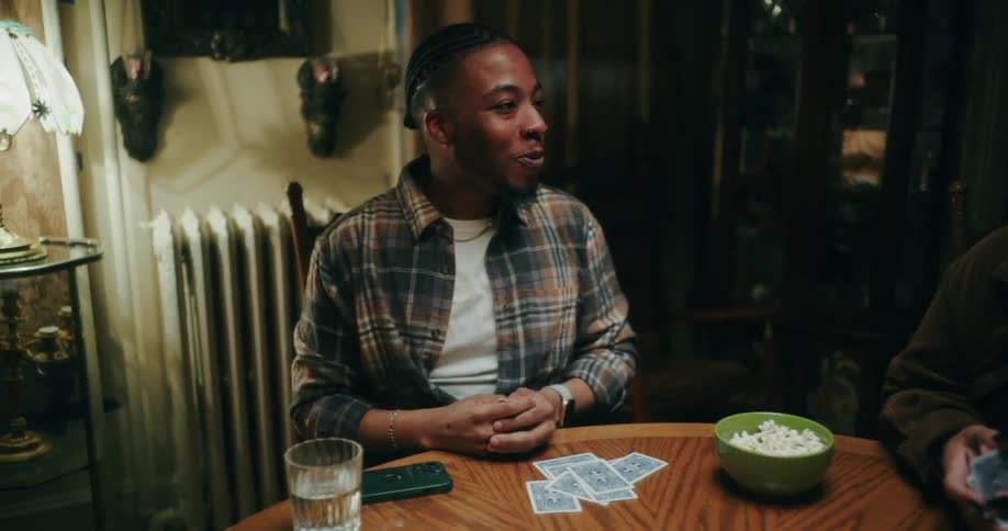 A footage of a family playing a card game indoor