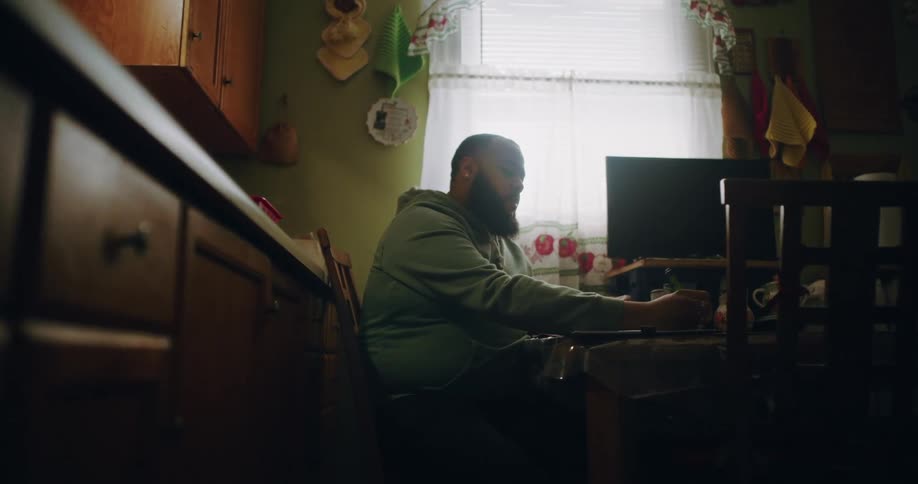 Man sitting at table writing