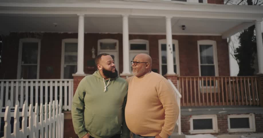 Father and son hugging in the backyard
