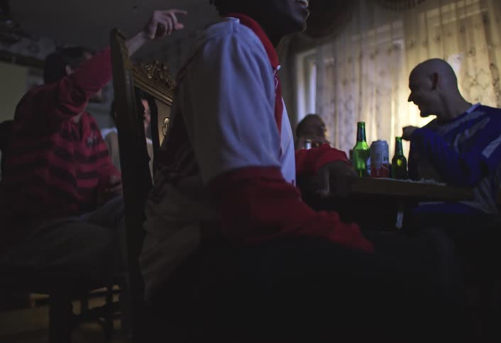 Group of friends sitting at a table having fun with drinks