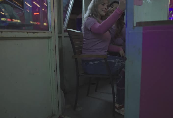 Teenage employees take selfies at the carnival