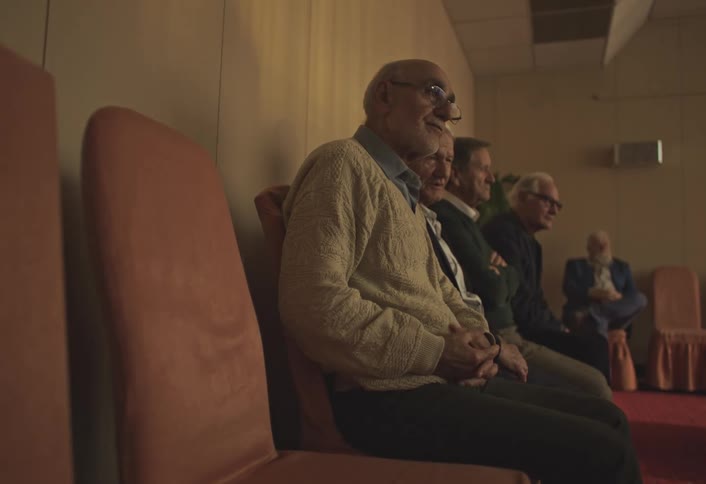 A footage of elderly men having a discussion while sitting