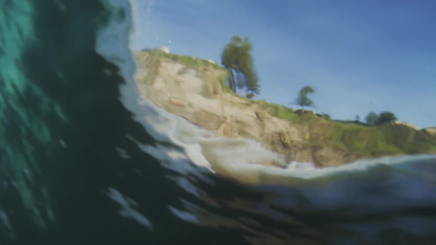 A wave crashes in the ocean