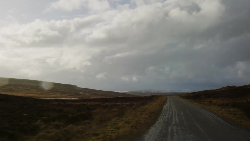 A dirt path runs through the landscape