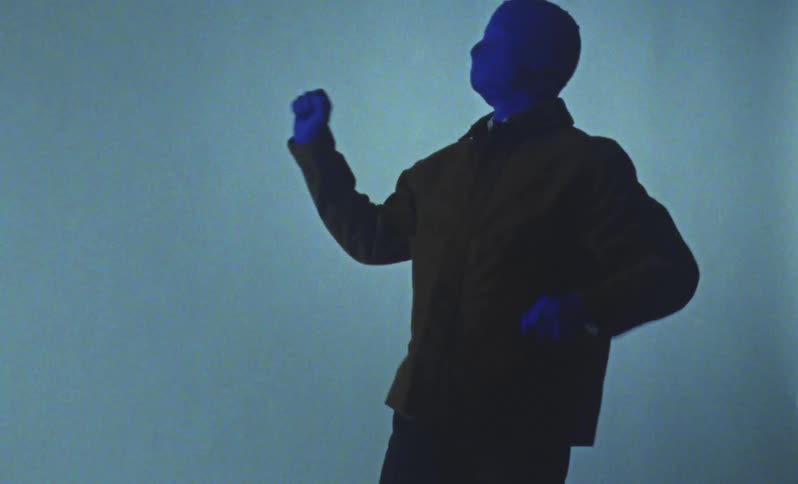 A man in a mask is dancing